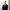 Portrait of Nicolas Offroy, Principal Consultant, Australia, standing in office space against window and plants.