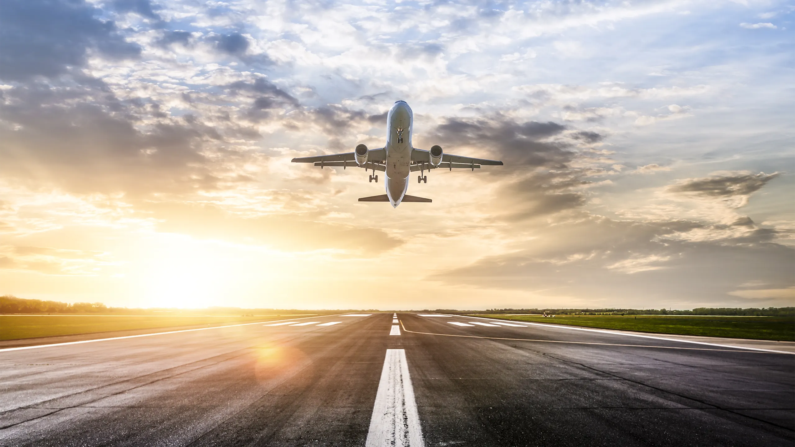 Passenger airplane taking of at sunrise
