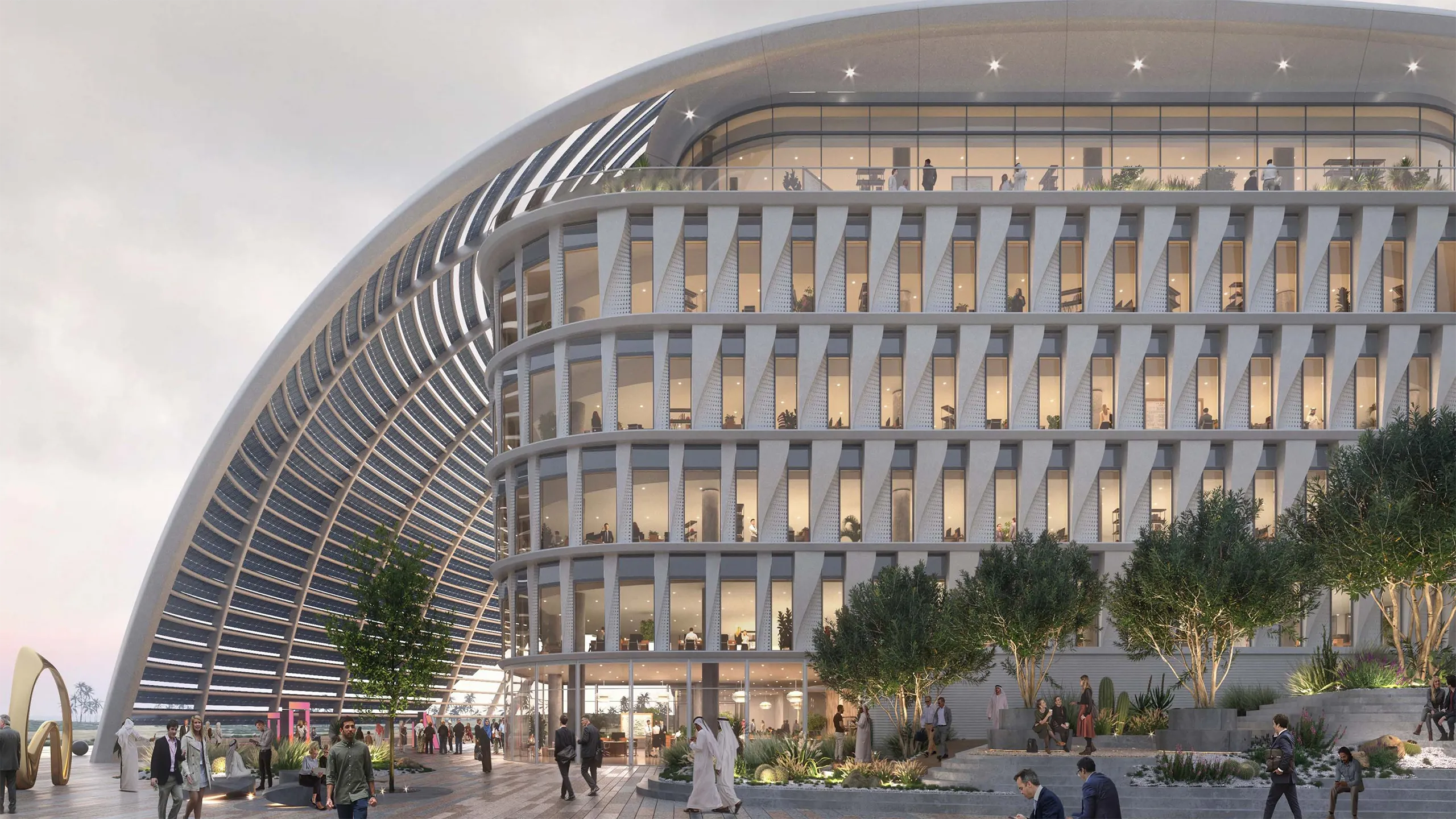 A futuristic, white multi-story office campus building. 