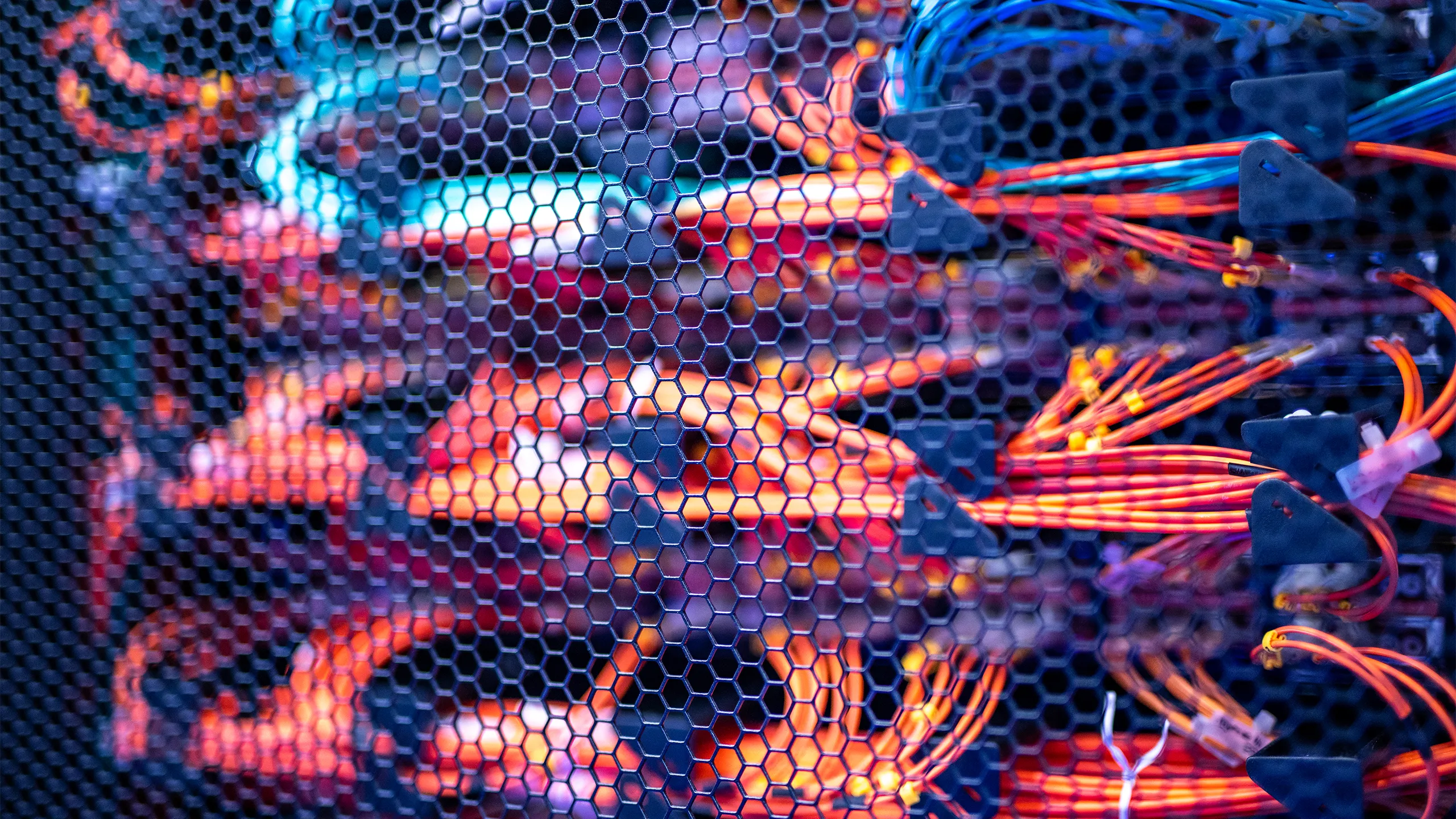 Red and orange cables in server room.