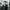 Vincent Tameeris, Assistant Consultant, Singapore, standing outside an office with his arms folded, smiling