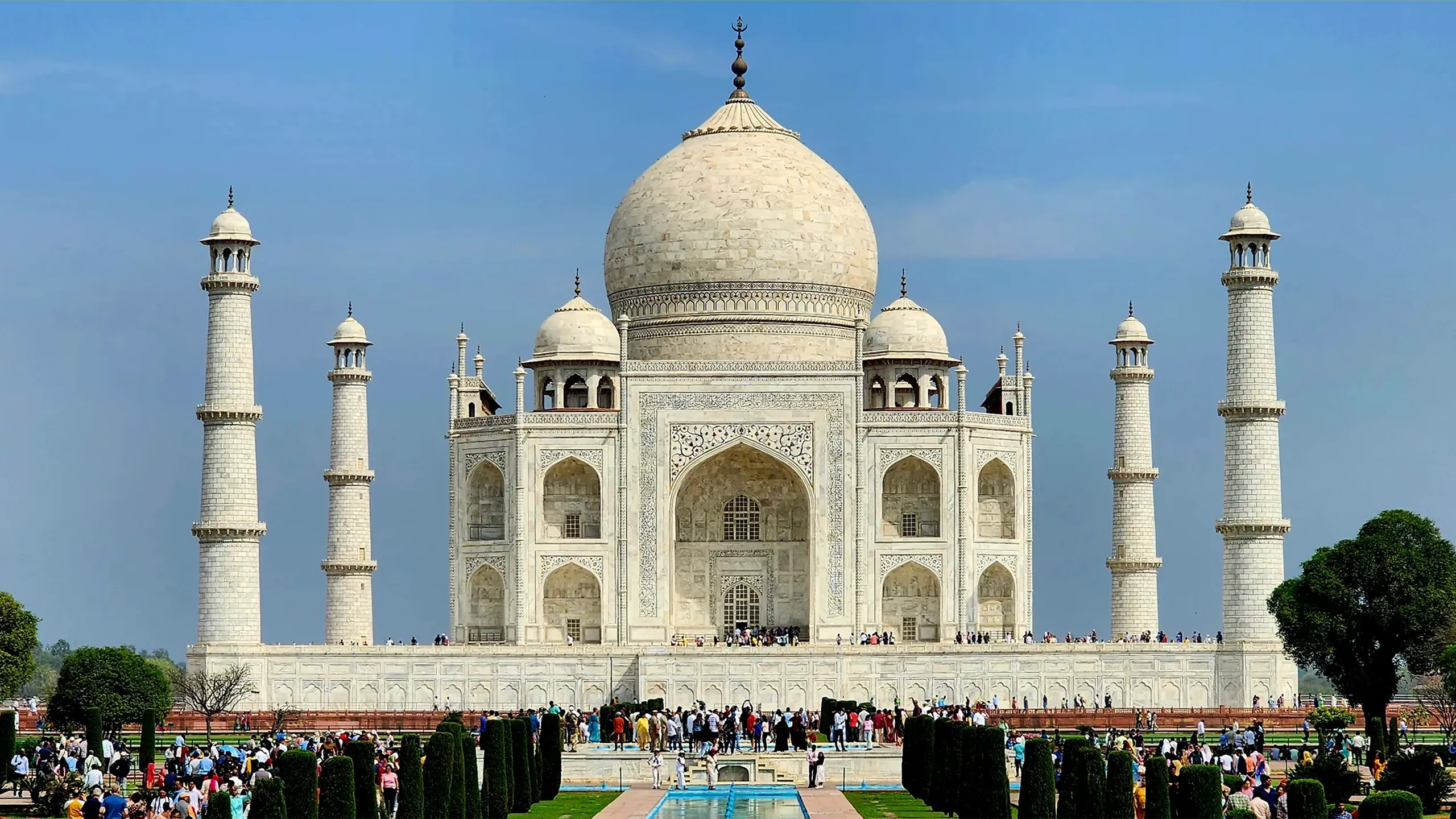 View of the Taj Mahal on a busy sunny day