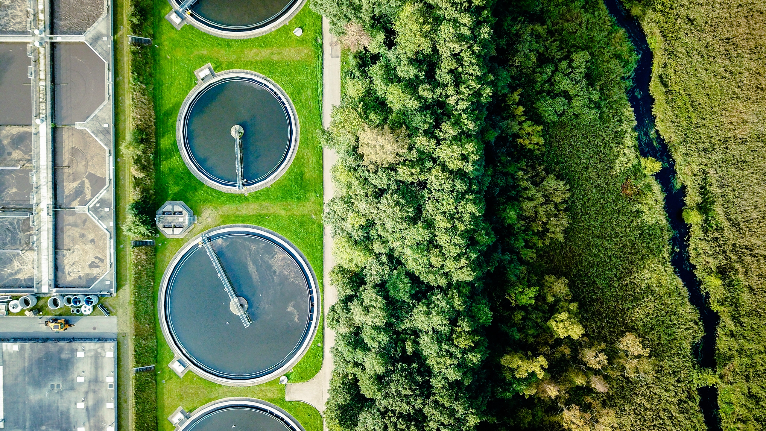 Aerial shot of water tanks in field